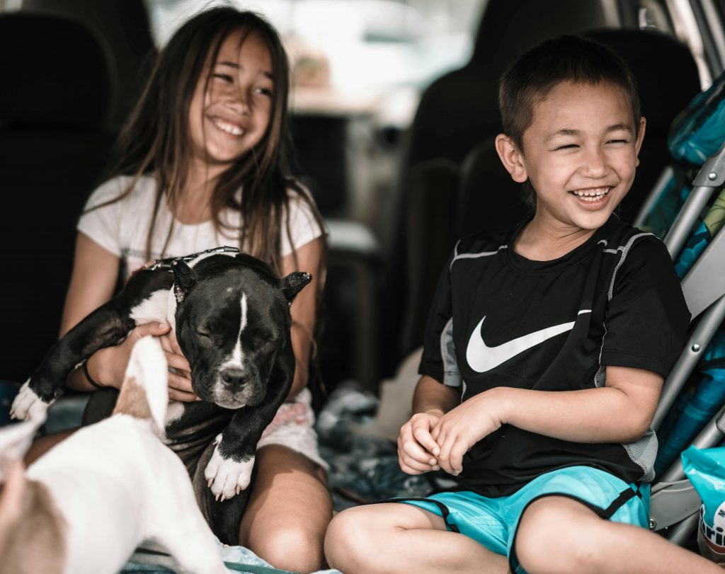 Kids sitting in a car with a puppies for sale in Columbus Ohio from Boundless Horizon Puppies